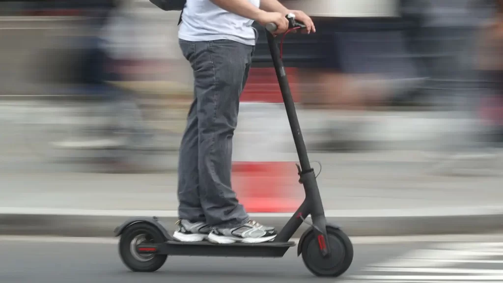 riding electrical scooter