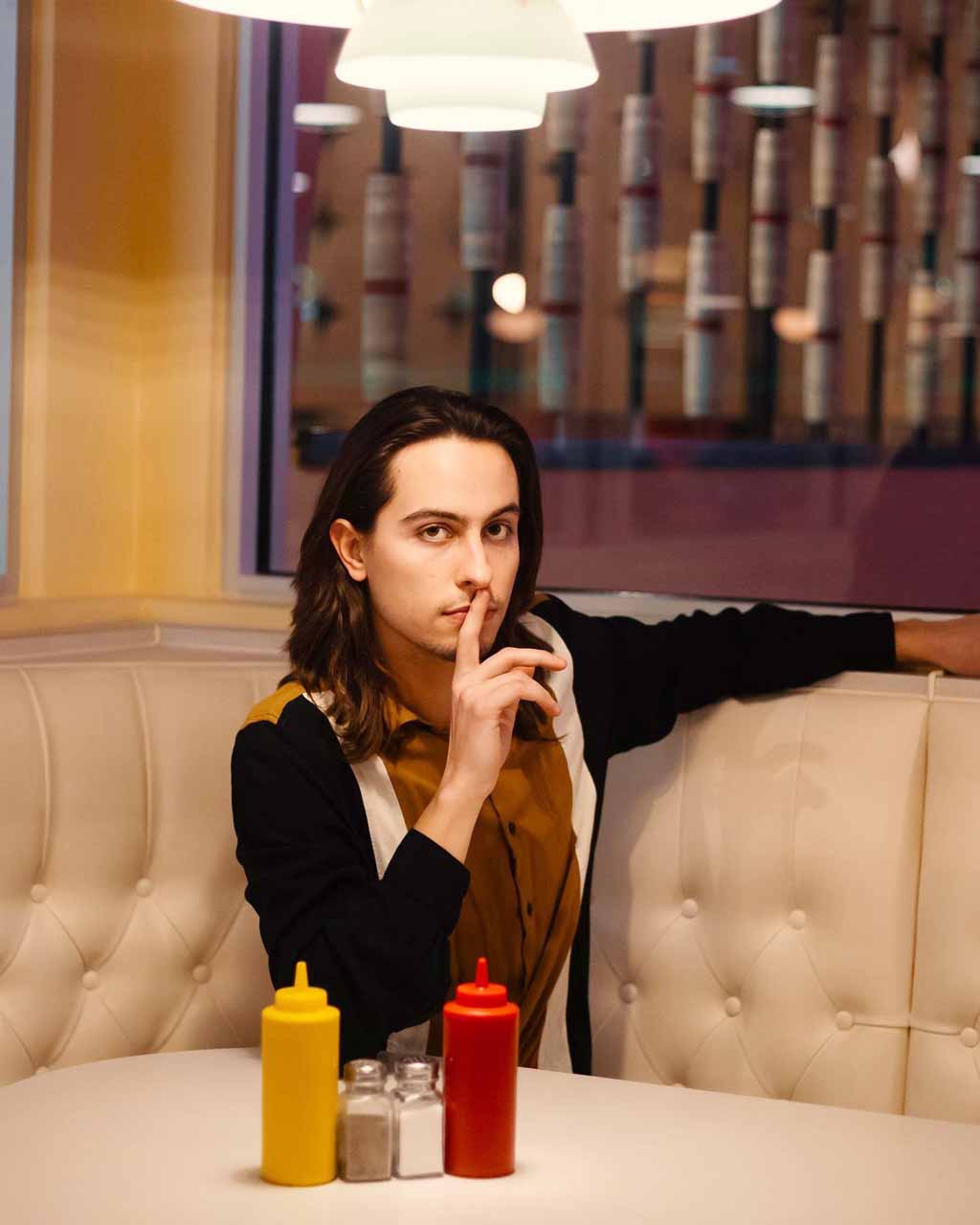 Sam Kiszka sitting in resturant